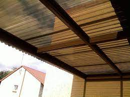 9.0M X 9.0M CARPORT, 6MM POLYCARBONATE BRONZE ROOF. STEEL FRAME (SPRAY PAINTED WITH BLACK ENAMEL)..